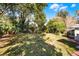Large grassy backyard with mature trees at 1642 Athens St, Lakeland, FL 33803