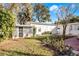 Landscaped backyard with a brick patio and shed at 1642 Athens St, Lakeland, FL 33803