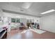 Spacious finished basement with ample natural light and brick flooring at 1642 Athens St, Lakeland, FL 33803
