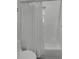 Clean bathroom with a tub and shower combination at 1642 Athens St, Lakeland, FL 33803