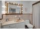 Retro bathroom with vanity, lighted mirror, and shower/tub combo at 1642 Athens St, Lakeland, FL 33803