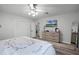 Main bedroom with king bed, built-in shelving, and updated flooring at 1642 Athens St, Lakeland, FL 33803