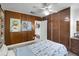 Stylish bedroom with wood paneling and a comfortable bed at 1642 Athens St, Lakeland, FL 33803