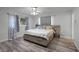 Main bedroom with king-size bed, dresser, and ceiling fan at 1642 Athens St, Lakeland, FL 33803