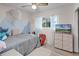 Cozy bedroom featuring a plush bed and built-in dresser at 1642 Athens St, Lakeland, FL 33803