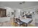 Bright dining room with a farmhouse table and view into the kitchen at 1642 Athens St, Lakeland, FL 33803