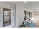 Inviting front porch with tiled flooring, seating area, and large windows at 1642 Athens St, Lakeland, FL 33803