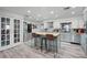 Updated kitchen featuring an island with seating and stainless steel appliances at 1642 Athens St, Lakeland, FL 33803