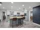 Modern kitchen with island, light cabinets, and chalkboard accent wall at 1642 Athens St, Lakeland, FL 33803