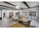 Living area with sectional sofa, coffee table, and built-in shelving at 1642 Athens St, Lakeland, FL 33803
