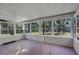 Screened porch with brick flooring and string lights at 1642 Athens St, Lakeland, FL 33803