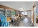 Spacious sunroom with unique flooring and plenty of windows at 1642 Athens St, Lakeland, FL 33803