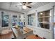 Sunroom boasts a ceiling fan and ample natural light at 1642 Athens St, Lakeland, FL 33803