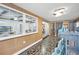 Sunroom features sliding glass doors and views of the backyard at 1642 Athens St, Lakeland, FL 33803