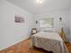 Bright bedroom with double bed and wood floors at 2007 Natalen Rd, Winter Park, FL 32792