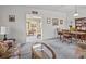 Cozy living room with wood coffee table, and view to dining area at 2007 Natalen Rd, Winter Park, FL 32792