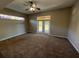 Spacious bedroom with carpet and sliding doors to patio at 2809 Strand Loop Ct, Oviedo, FL 32765