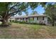 Ranch-style home with mature landscaping and a spacious yard at 3116 Oranole Rd, Orlando, FL 32810