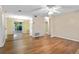 Open living room with hardwood floors and access to dining area at 3116 Oranole Rd, Orlando, FL 32810