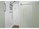 Walk-in shower with grab bar and tiled walls at 3116 Oranole Rd, Orlando, FL 32810
