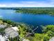 Aerial view of lakefront property with walking pier at 3315 Parkchester Square Blvd # 102, Orlando, FL 32835