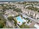 Aerial view of community pool, landscaping, and residential buildings at 3315 Parkchester Square Blvd # 102, Orlando, FL 32835