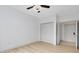 Bedroom with ceiling fan, double doors to closet and access to hallway at 3315 Parkchester Square Blvd # 102, Orlando, FL 32835