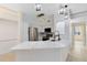 Modern kitchen with white cabinets, quartz countertops, and island at 3315 Parkchester Square Blvd # 102, Orlando, FL 32835