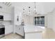 Modern kitchen with stainless steel appliances and breakfast bar at 3315 Parkchester Square Blvd # 102, Orlando, FL 32835