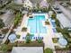 Aerial view of community pool with lounge chairs and gazebos at 3315 Parkchester Square Blvd # 102, Orlando, FL 32835