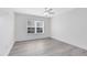Second bedroom with hardwood floors and ceiling fan at 3433 Soho St # 204, Orlando, FL 32835