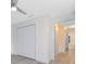Spacious bedroom with double doors leading to hallway and large closet at 3433 Soho St # 204, Orlando, FL 32835