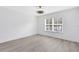 Bright bedroom with hardwood floors and ceiling fan at 3433 Soho St # 204, Orlando, FL 32835