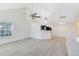 Open living area with high ceilings and hardwood floors at 3433 Soho St # 204, Orlando, FL 32835