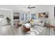 Spacious living room with light flooring and modern furniture at 3433 Soho St # 204, Orlando, FL 32835