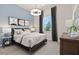 Cozy bedroom with a comfortable bed and stylish decor at 5190 Foothills Preserve Loop, Mount Dora, FL 32757