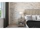 Bedroom detail showcasing a nightstand with lamp and a glimpse of the bed at 5190 Foothills Preserve Loop, Mount Dora, FL 32757