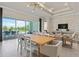 Dining room with a large wooden table, and views of the pool and backyard at 5190 Foothills Preserve Loop, Mount Dora, FL 32757