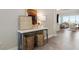 Bright entryway with console table, two baskets, and view into living room at 5190 Foothills Preserve Loop, Mount Dora, FL 32757