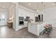 Modern kitchen with white cabinets, large island, and stainless steel appliances at 5190 Foothills Preserve Loop, Mount Dora, FL 32757