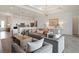 Bright and airy living area showcasing an open floor plan with kitchen and dining area visible at 5190 Foothills Preserve Loop, Mount Dora, FL 32757