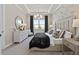 Serene main bedroom featuring a large bed, ample natural light, and stylish decor at 5190 Foothills Preserve Loop, Mount Dora, FL 32757