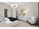 Main bedroom with large bed, dresser, seating area and an ensuite bathroom at 5190 Foothills Preserve Loop, Mount Dora, FL 32757