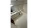 Bathroom with granite countertop, white cabinets and bathtub at 5500 Metrowest Blvd # 101, Orlando, FL 32811