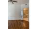 Bedroom with wood-look floors and bathroom access at 5500 Metrowest Blvd # 101, Orlando, FL 32811