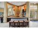 Community kitchen with granite counters, stainless steel appliances, and breakfast bar at 5500 Metrowest Blvd # 101, Orlando, FL 32811