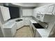 Kitchen with white cabinets and granite countertops at 5500 Metrowest Blvd # 101, Orlando, FL 32811