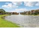 Community lake with fountain and lush landscaping at 5500 Metrowest Blvd # 101, Orlando, FL 32811