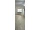 Spacious living room with tile floors and kitchen view at 5500 Metrowest Blvd # 101, Orlando, FL 32811