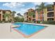 Inviting community pool with lounge chairs at 5500 Metrowest Blvd # 10, Orlando, FL 32811